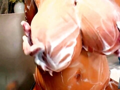 Hitomi Tanaka covers herself in bubbles while rubbing her tits! - Asian