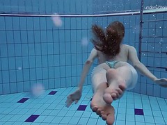 super slender girl showing off her beauty underwater