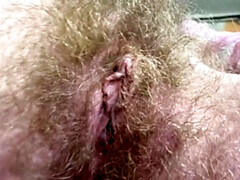 Cute Amateur Blonde Smoking Cigar and Showing Hairy Bush Close Up