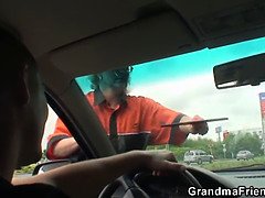 Blonde old woman pleases two strangers in the fields