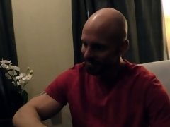 Black doctor removing something from the ass of a white guy