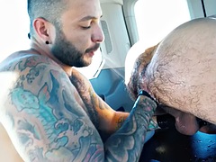 Jock gives hairy ass licking to tattooed gay daddy in van