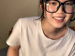Girl with glasses masturbates