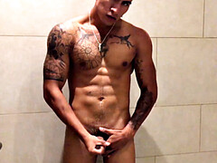 Our featured solo boy of the week is Erick, a muscular and inked young Latino who invites us to watch as he jerks off in the shower.