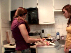 buxom milf trains young brunette how to cook & then some