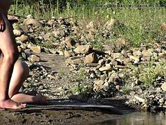Fucking in a public place on the bank of a mountain river