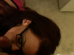 Girlfriend with glasses sucks on a raging boner