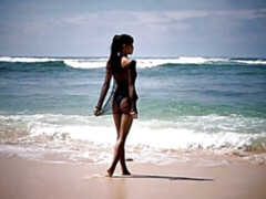 Cute Asian teen IyaQ shows off her godlike naked body on the beach