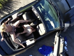 Busty dame and young lassie enjoy each other in the cabriolet