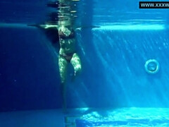 Kittina swims naked in the swimming pool