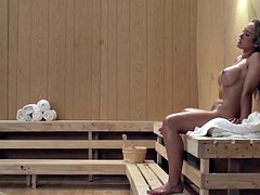 Busty lezdom sauna action with two stunners