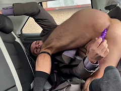 Businessman in socks has sex in the car using a dildo